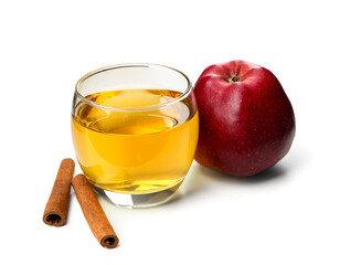 Ripe apple, glass of fresh juice and cinnamon sticks on white background