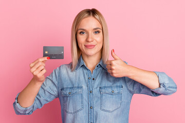 Fototapeta premium Portrait of pretty person hold banking card hand showing like symbol isolated on pastel color background