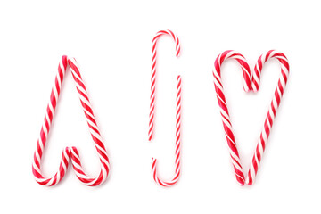 Composition with tasty candy canes on white background