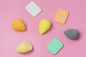 Colored Make up Egg Make up Sponge Puff make up Ugg Makeup Tool Concept Pink Background