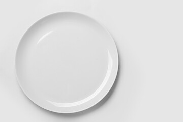 Empty ceramic plate on white background, top view. Space for text