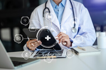 medical technology concept,smart doctor hand working with modern laptop computer with his team...