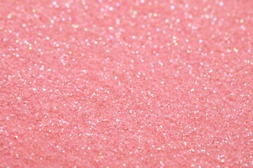Beautiful pink shiny glitter as background, closeup