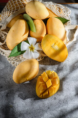 yellow mango on a gray background