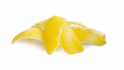 Pieces of fresh lemon peel on white background. Citrus zest