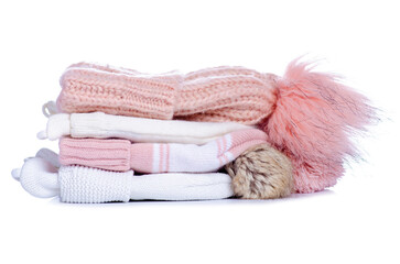 Stack of warm hats on white background isolation