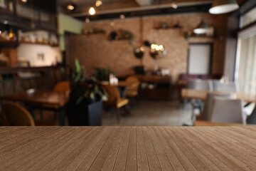 Empty wooden surface in cafe. Space for design