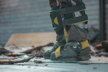 Different safety equipment for arborist or arborists such as boots, shoes, knee and shin guards on...