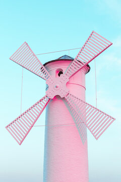 Trending color coral pink surreal lighthouse windmill on a blue sky pastel background