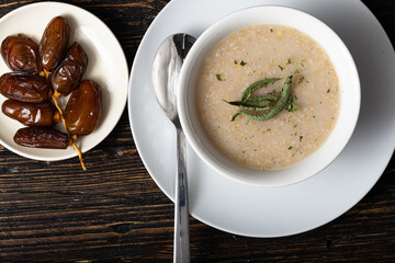 top view of a traditional Moroccan belboula,  Cream of Barley Soup with Dried date