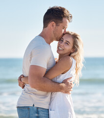 Obraz premium Couple, beach and hug bonding with a kiss, love and care happy about anniversary and commitment. Portrait of a girlfriend and boyfriend together on summer vacation smile feeling freedom on holiday