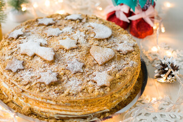 Christmas cake with gingerbread decorations. Homemade Christmas cake. Christmas cake with christmas tree.