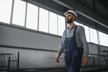 portrait of a worker in uniform at the factory