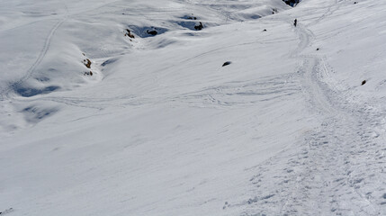 a trail in the snow a beautiful sunny day in the winter snowy mountains