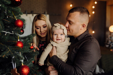 Portrait of a young family in the studio