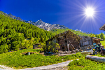 Abandoned house and tractor in Swiss Alps, Randa, Visp, Wallis,