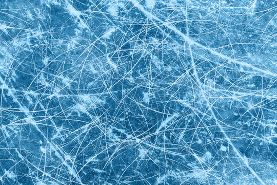 Ice blue background with ice skating tracks. Frozen water, sea. Frosty ice texture with winter graphic scratches. Hockey rink. Rendering image.