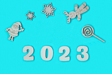 Happy New year 2023 number wood object on blue background and copy space - new year celebrate and business resource concept - marketing resource design mock up.
