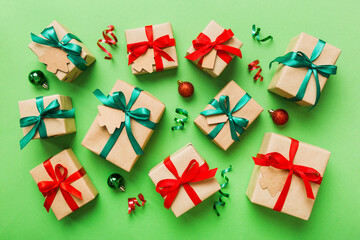 Colored craft gift boxes with colorful ribbons on colored background. Collection of Christmas...