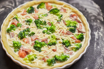 Homemade quiche with red fish, salmon, broccoli and cheese