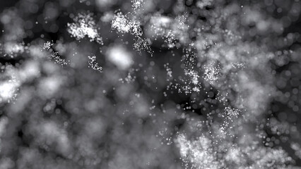 3D rendering of cluster of white particles flitting about on black background with bokeh