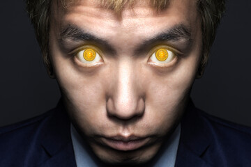 close up of business man face with crypto bitcoin eyes