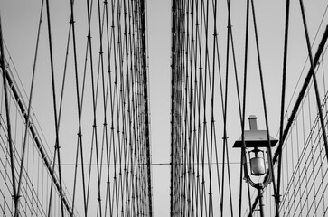 Brooklyn Bridge spanning the East River between Manhattan and Brooklyn, in New York City, abstract,...