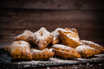 TRADITIONAL WONDERS OF SOUTH-WESTERN FRANCE, SPRINKLED WITH ICING SUGAR AND FLAVOURED WITH RUM AND ORANGE FLOWER WATER, High quality photo