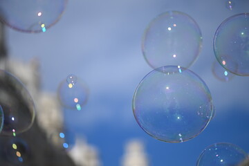 Soap bubbles in front of a blurred building in the inner city of Valencia-Spain.