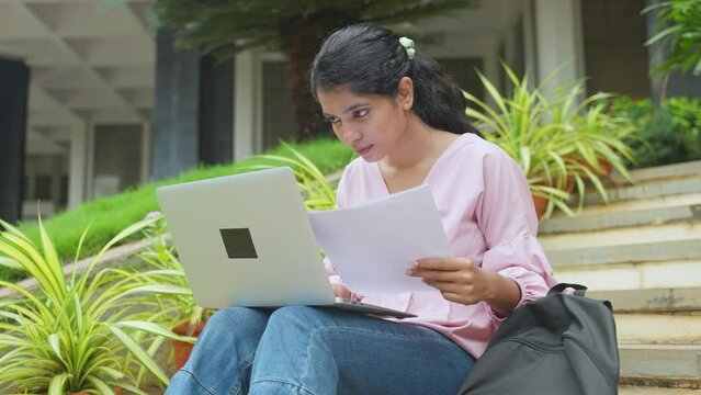 young student at college campus buys working on project using laptop - concept of learning or exam preparation, knowledge and hard-working