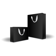 Blank black paper shopping bags or gift bags with ribbon handles mockup template. Isolated on white background with shadow. Ready to use for branding design. Realistic vector illustration.