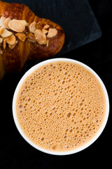 French breakfast coffee cappuccino with fresh croissant.