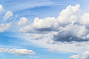 White clouds in a bright blue sky. The beauty of the nature