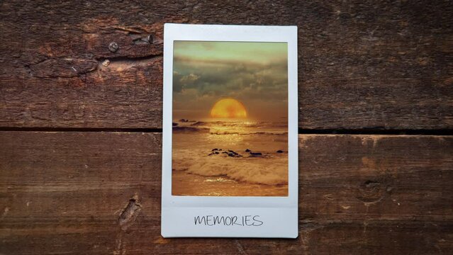 Instant Picture Frame Sunset Ocean Landscape Zoom In. Sun setting down in the ocean inside an instant picture frame. Zoom in