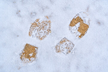 Footsteps on snow ground on the first snowy day