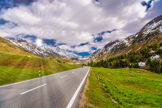 Road amoung snowy Alps mountains, Fluelapass, Davos, Graubuende