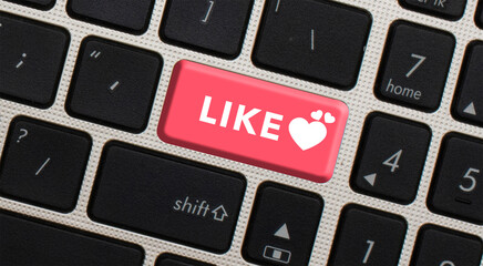 Like button written on a black keyboard. elective focus