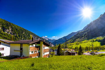 Fototapeta na wymiar Chalet and hotels in swiss village in Alps, Leukerbad, Leuk, Vis