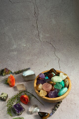 various gem stones in a wooden bowl