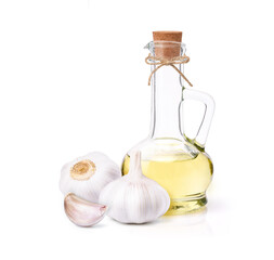 Garlic oil with garlic clove and bulb isolated on white background.
