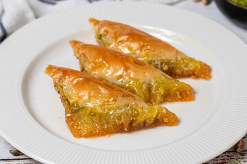 Sobiyet baklava on a white wooden background. Turkish cuisine delicacies. Turkish baklava. close up