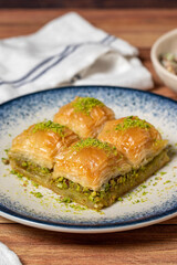 Pistachio baklava on wooden background. Turkish cuisine delicacies. Turkish baklava. close up