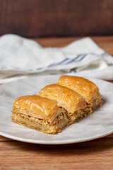 Walnut baklava on wooden background. Turkish cuisine delicacies. Turkish baklava. close up