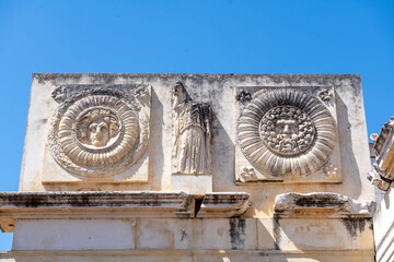 Archeology rehabilitated remains of a Roman construction with rose windows on a sunny day with clear blue summer skies in Merida, in Extremadura, Spain