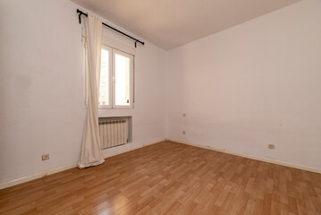 Residential house with light vintage stoneware floors, access to several rooms and wall lights on the ceiling