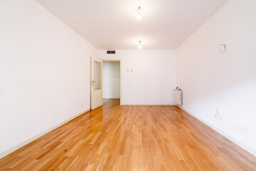 House with light varnished French oak wooden floors, access to several rooms and white aluminum radiator