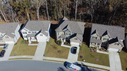 Close-up aerial view new development two story houses with two car garage drive way in Flowery Branch, Georgia, USA - obrazy, fototapety, plakaty