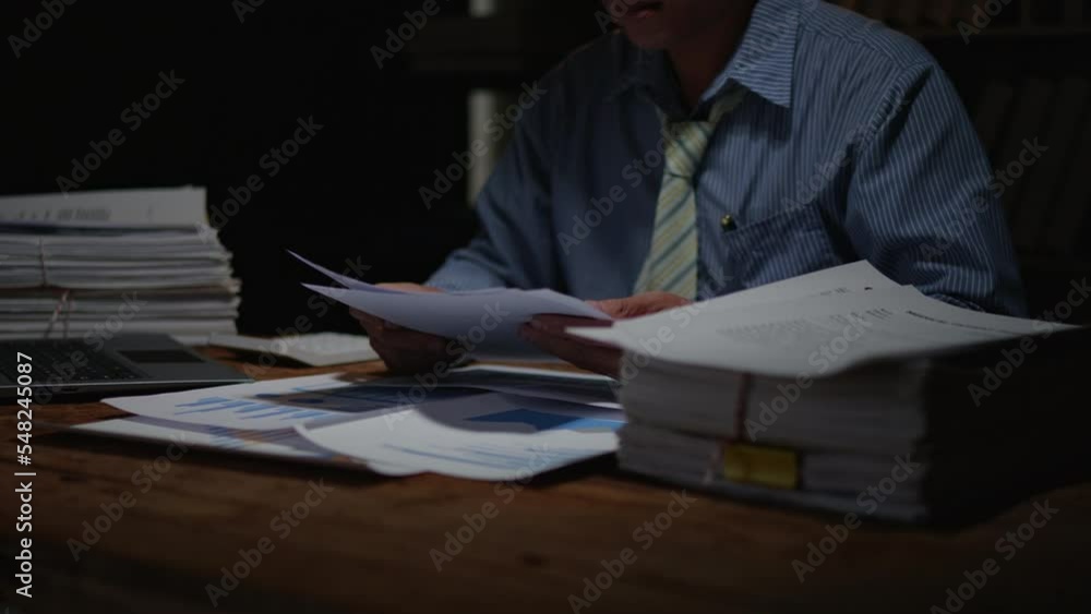 Poster close up of business hands working overtime night shift and calculating on financial and accounting 