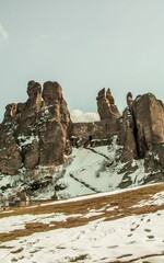 Vertical shot of snowy of strangely shaped Belogradchik Rocks in Bulgaria