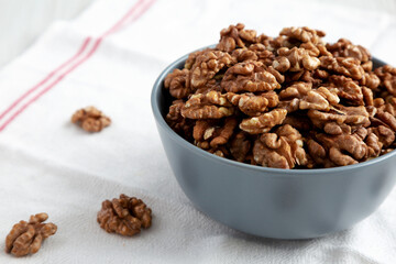 Raw Organic Walnuts in a Bowl, low angle view. Close-up.